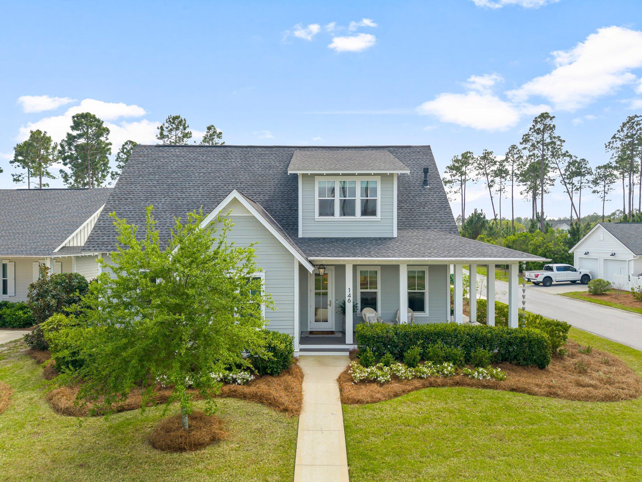 front view of a house with a yard