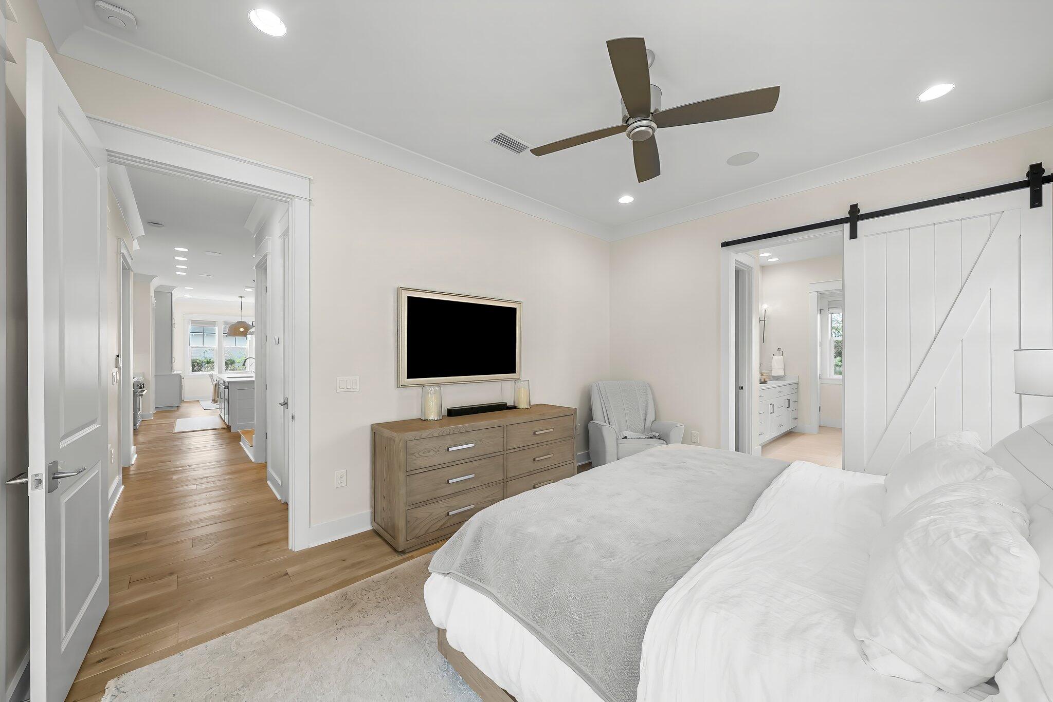 146 Trailhead Drive Inlet Beach, FL 32461 - Photo 16 of 74 a bedroom with a bed and a flat screen tv