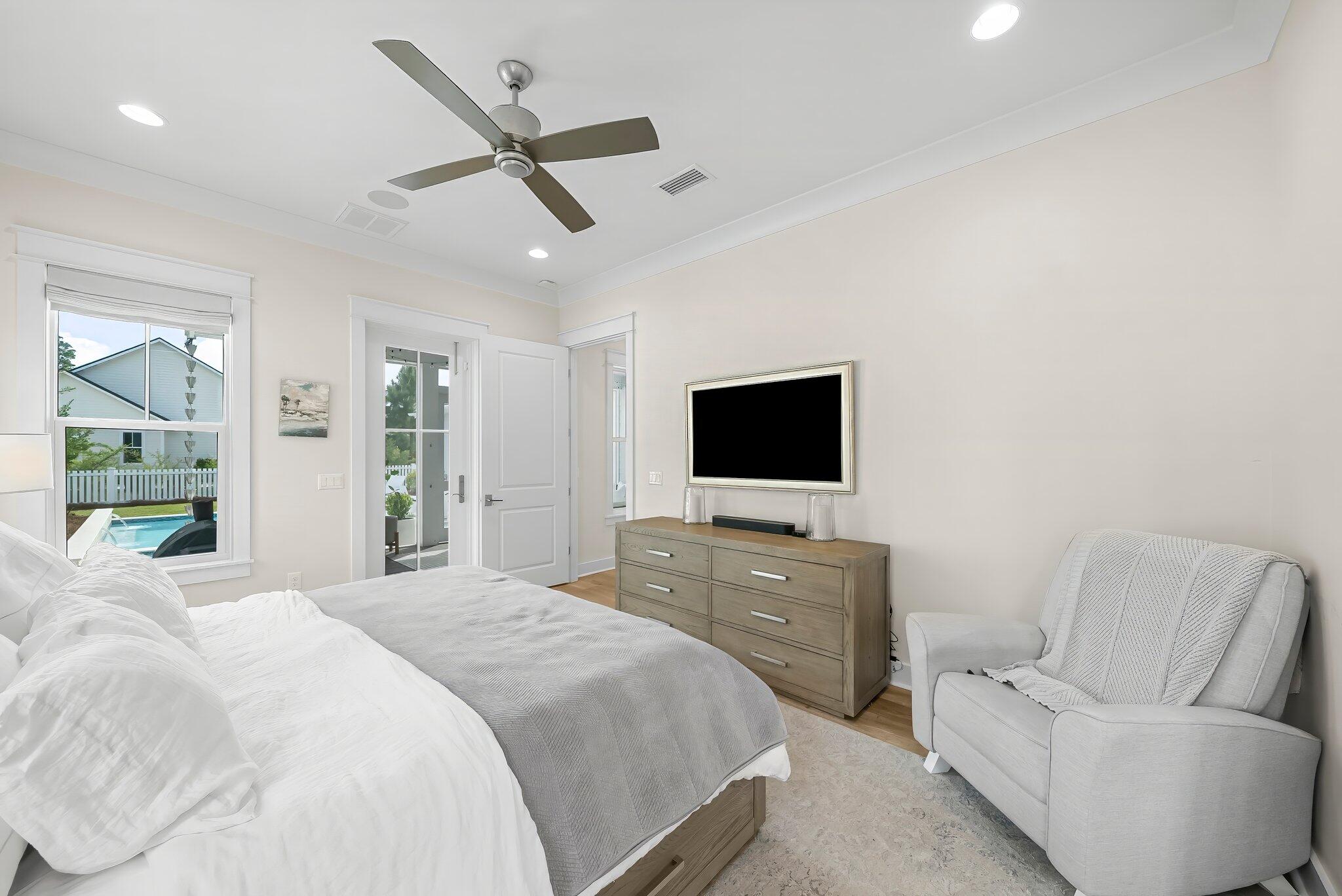 146 Trailhead Drive Inlet Beach, FL 32461 - Photo 17 of 74 a bedroom with a bed a couch and a flat screen tv