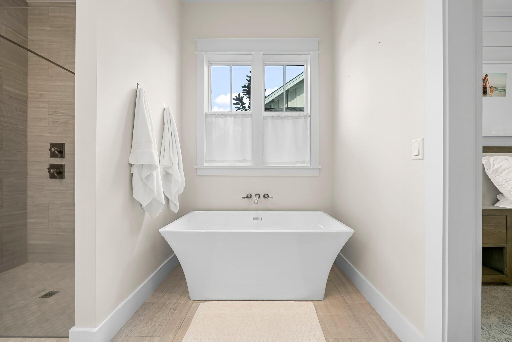 146 Trailhead Drive Inlet Beach, FL 32461 - Photo 18 of 74 a white bath tub sitting next to a window