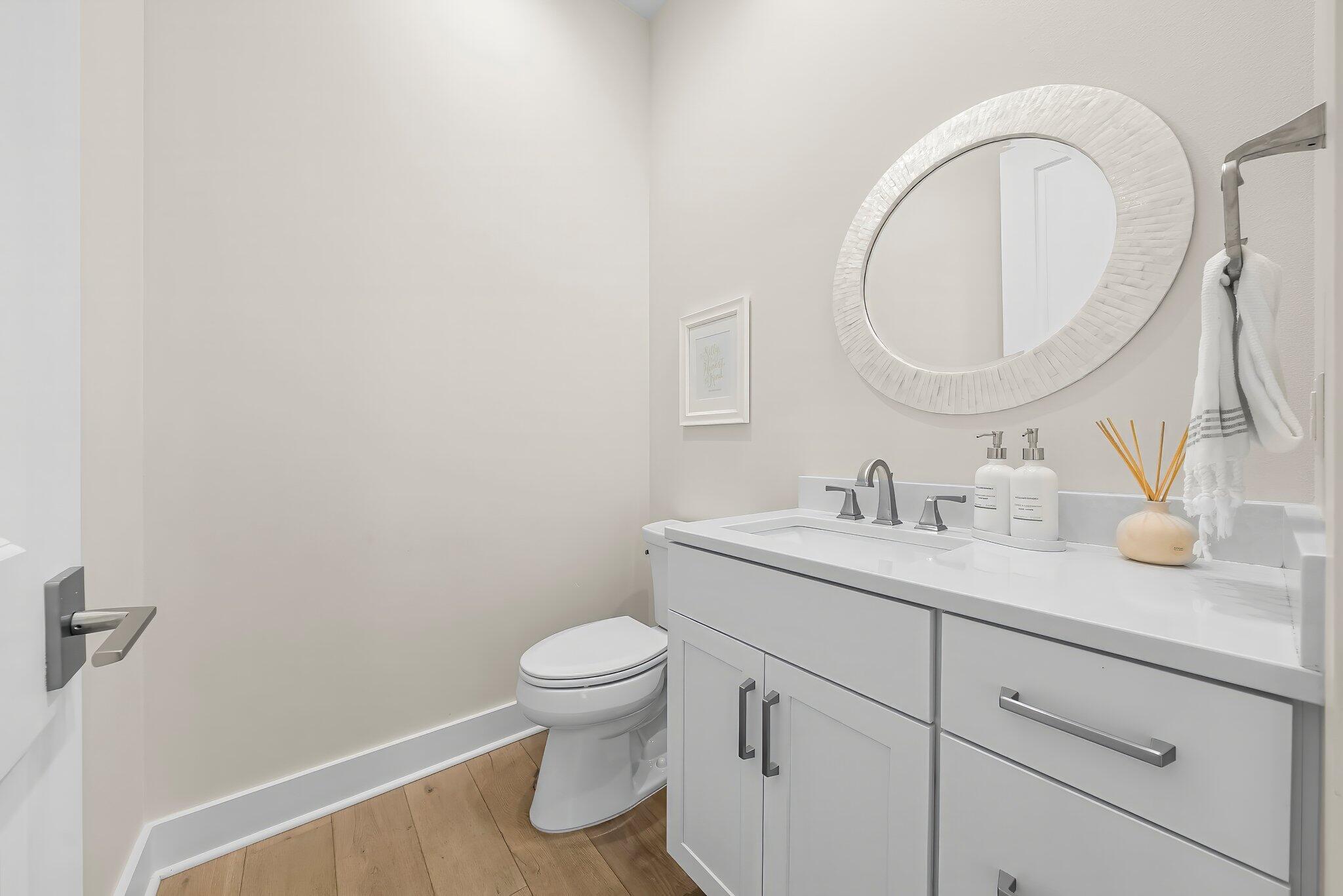 146 Trailhead Drive Inlet Beach, FL 32461 - Photo 22 of 74 a bathroom with a toilet sink and mirror