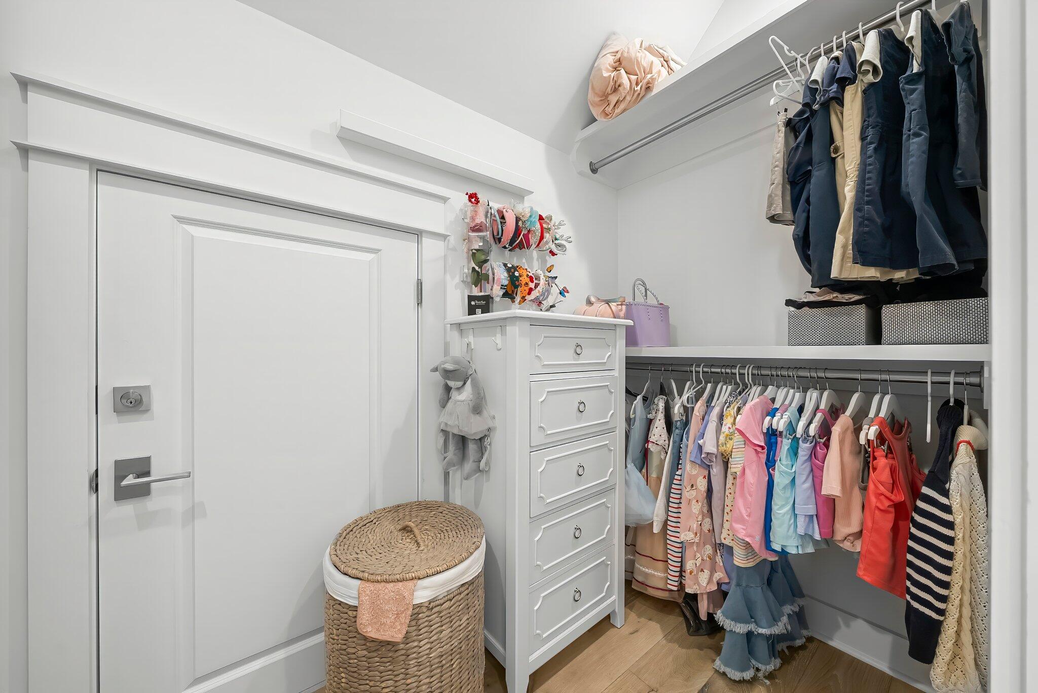 146 Trailhead Drive Inlet Beach, FL 32461 - Photo 33 of 74 a view of walk in closet with clothes and shoes