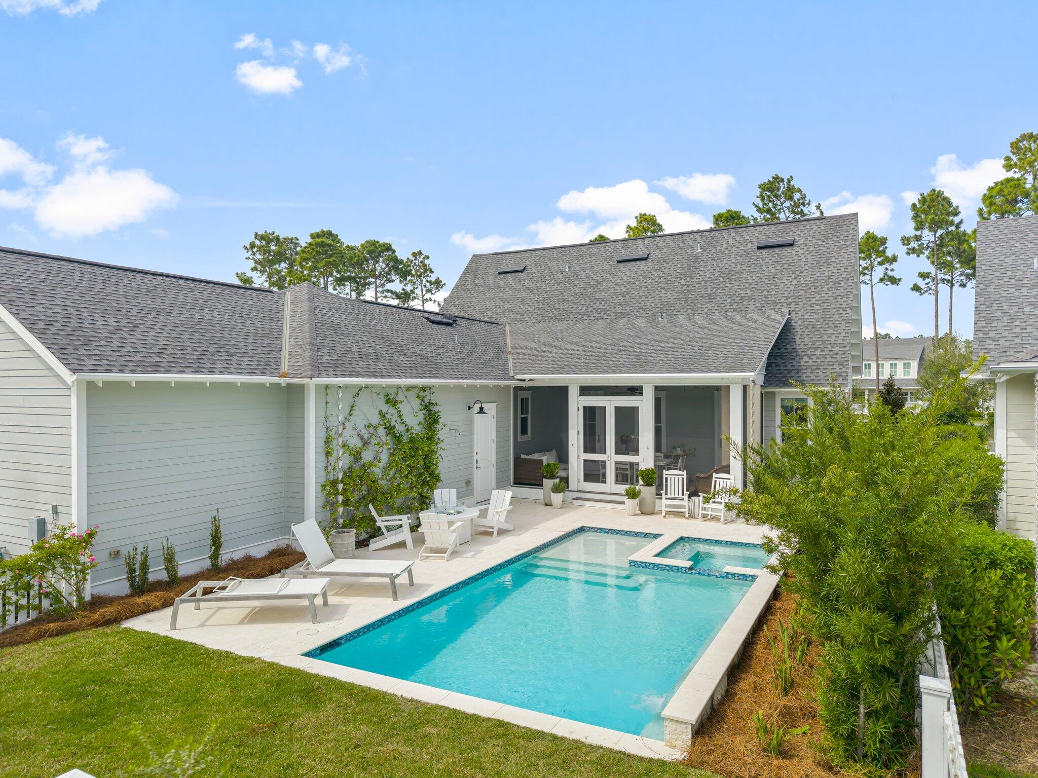 146 Trailhead Drive Inlet Beach, FL 32461 - Photo 42 of 74 a view of a house with pool and chairs