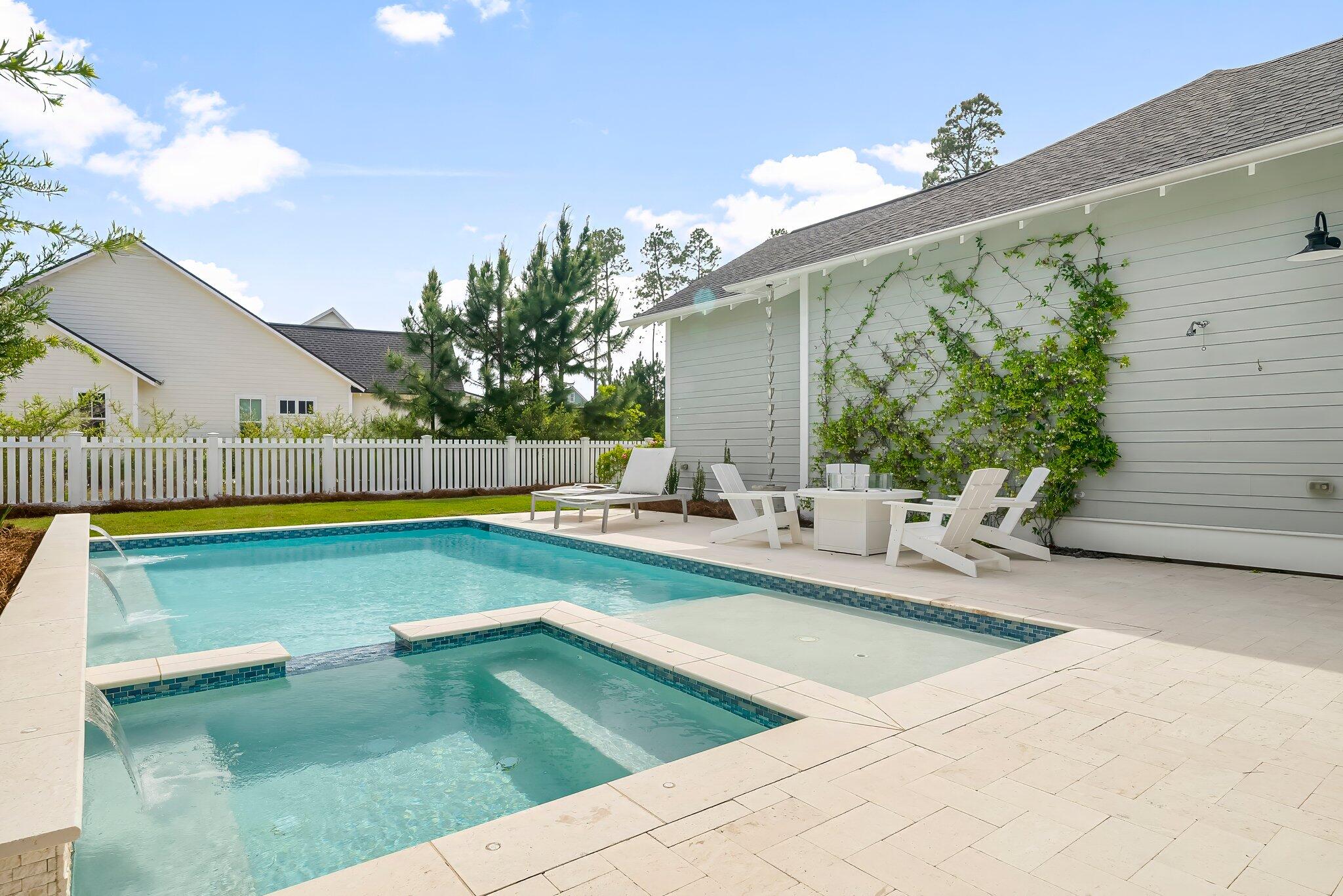 146 Trailhead Drive Inlet Beach, FL 32461 - Photo 44 of 74 a view of a swimming pool with a lounge chairs