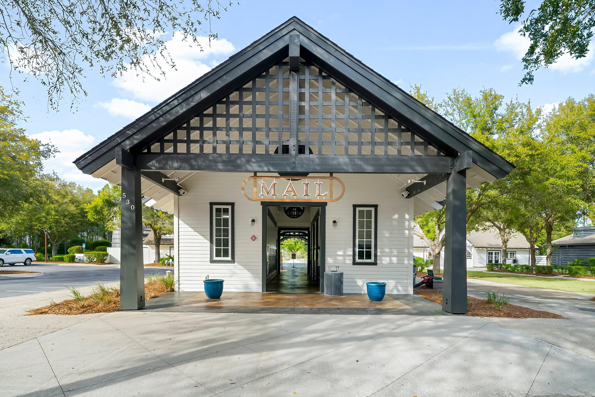 146 Trailhead Drive Inlet Beach, FL 32461 - Photo 49 of 74 a view of a house with a large windows and a large tree