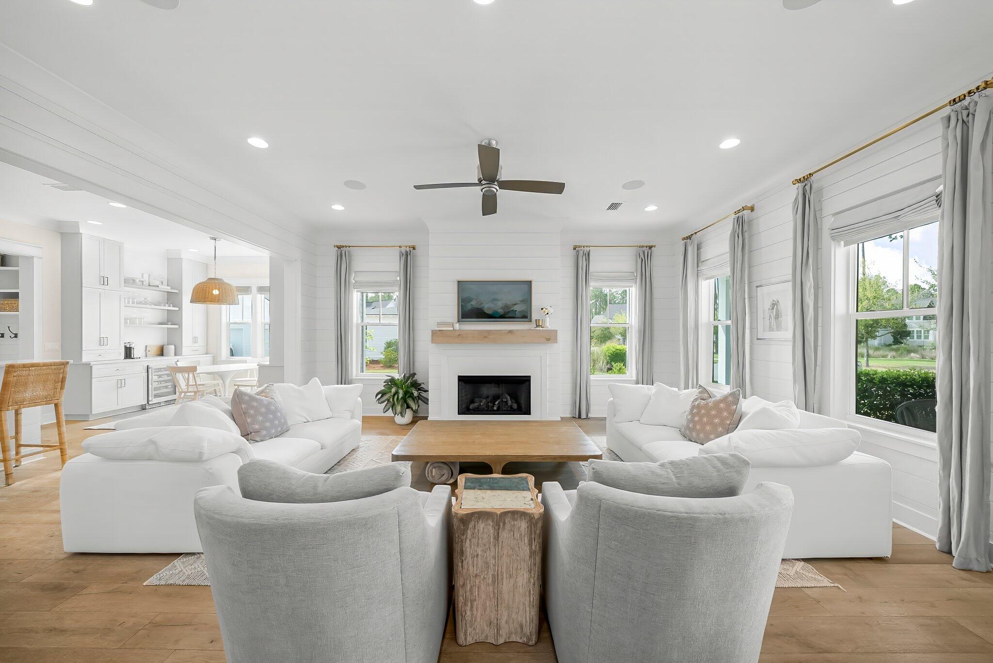 146 Trailhead Drive Inlet Beach, FL 32461 - Photo 6 of 74 a living room with furniture a fireplace and a large window