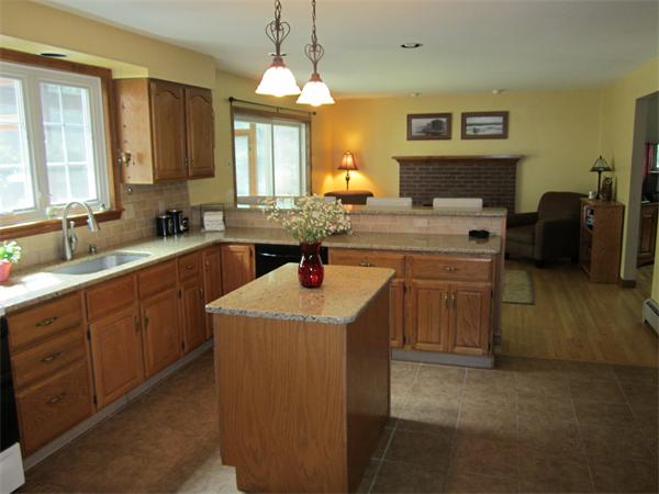 60 Rattle Hill Road Southampton, MA 01073 - Photo 10 of 28 a kitchen with a sink stove and cabinets