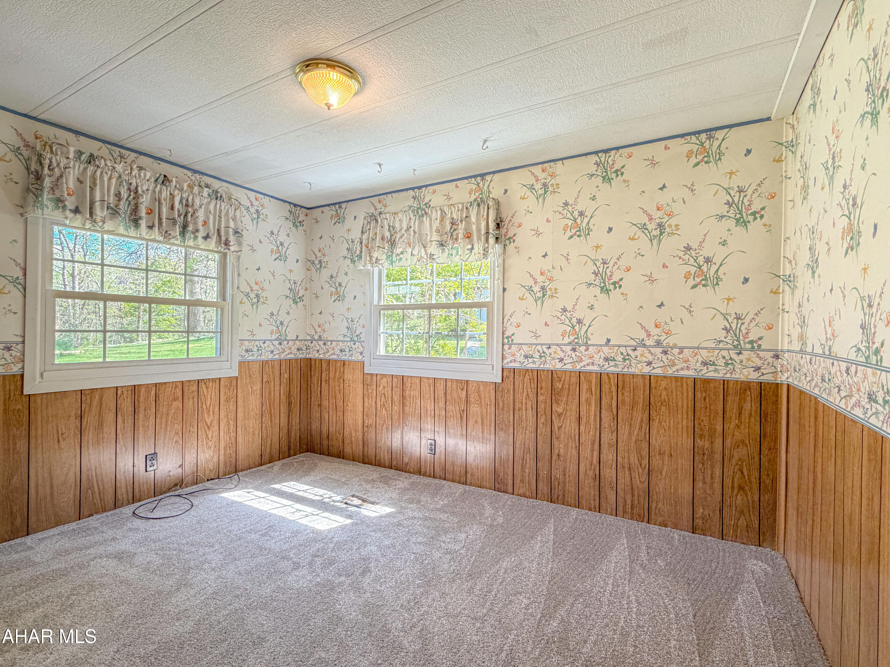 151 Pine Echo Road Everett, PA 15537 - Photo 28 of 51 wooden floor in an empty room with a window