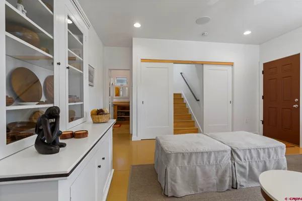 a kitchen with a sink a stove and cabinets