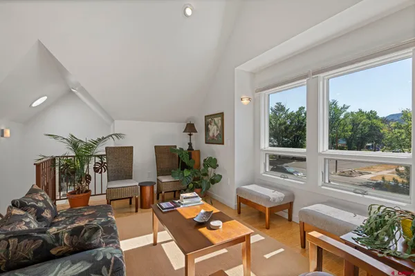 a kitchen with stainless steel appliances granite countertop a stove and a wooden floors