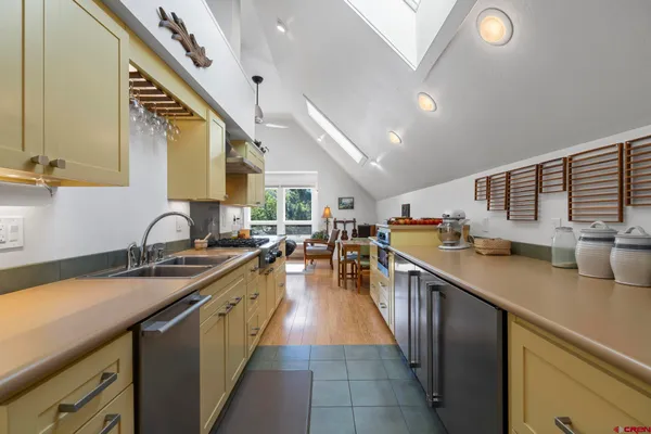 a bedroom with a bed and dresser with window