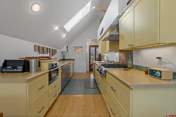a view of a house with a patio and wooden fence