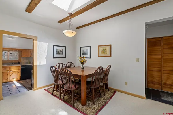 a bedroom with a bed and a mirror