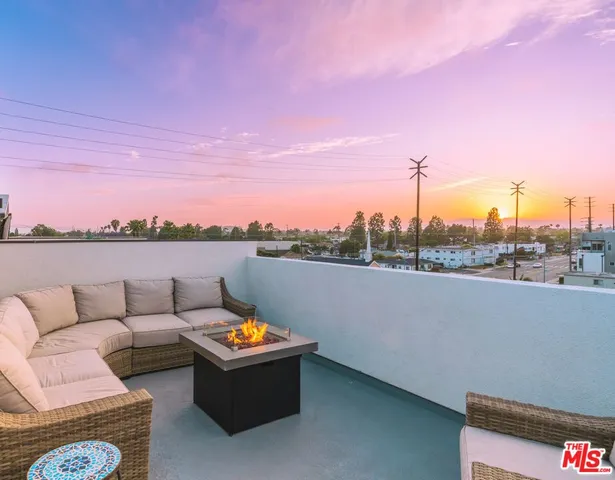 a view of a terrace with furniture