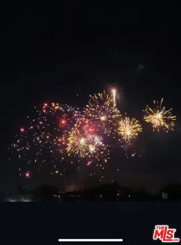 a view of a yard in front of the house with green space