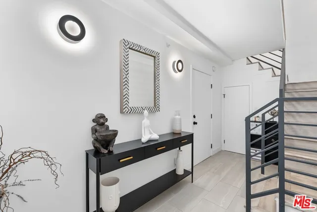 a room with gym equipment and mirror