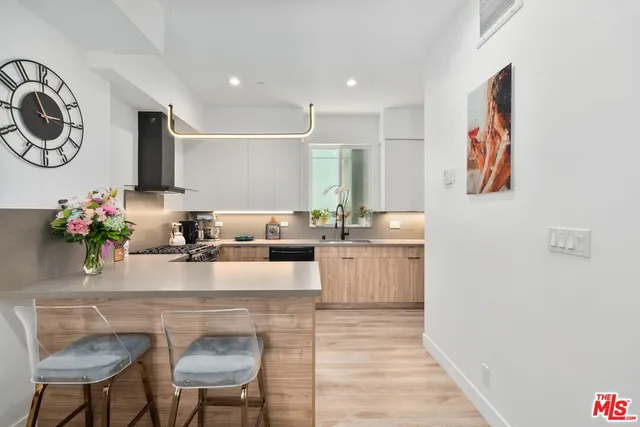 a kitchen with a table and chairs
