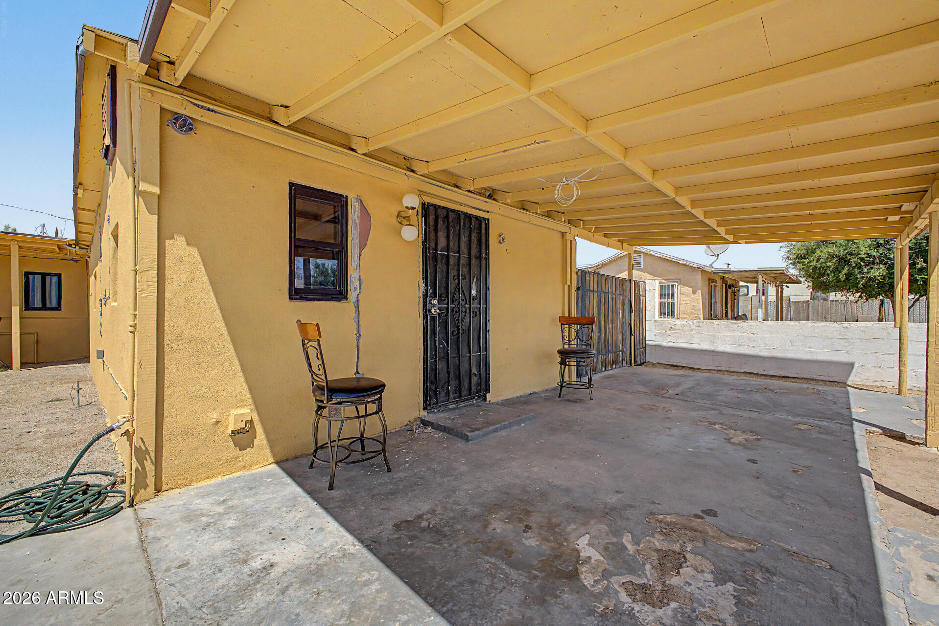 1612 South 5th Street Phoenix, AZ 85004 - Photo 4 of 27 a view of a patio with table and chairs and wooden floor