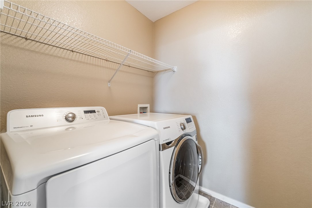 224 Positive Point Street Henderson, NV 89012 - Photo 34 of 44 Functional laundry space equipped with overhead shelving and durable flooring.