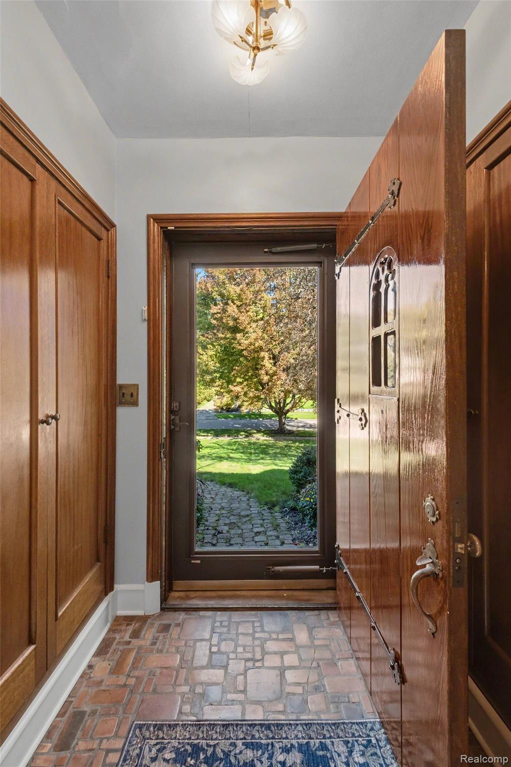 2030 Hampden Road Flint, MI 48503 - Photo 14 of 34 Solid wood entry door with ornate hardware and a decorative window
