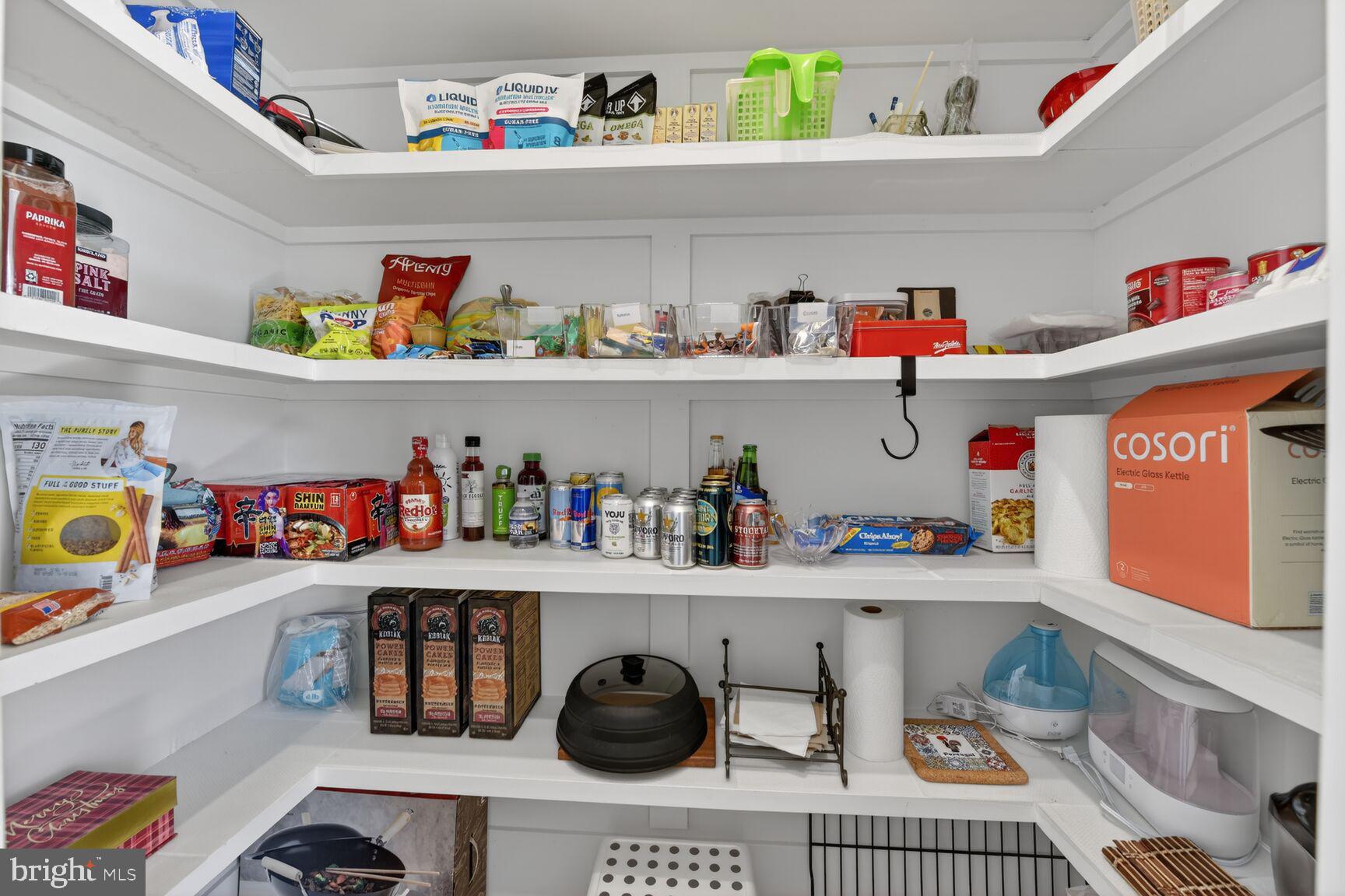 14665 Battery Ridge Lane Centreville, VA 20120 - Photo 16 of 66 a cabinet with granite countertop lots of clutter and stainless steel appliances