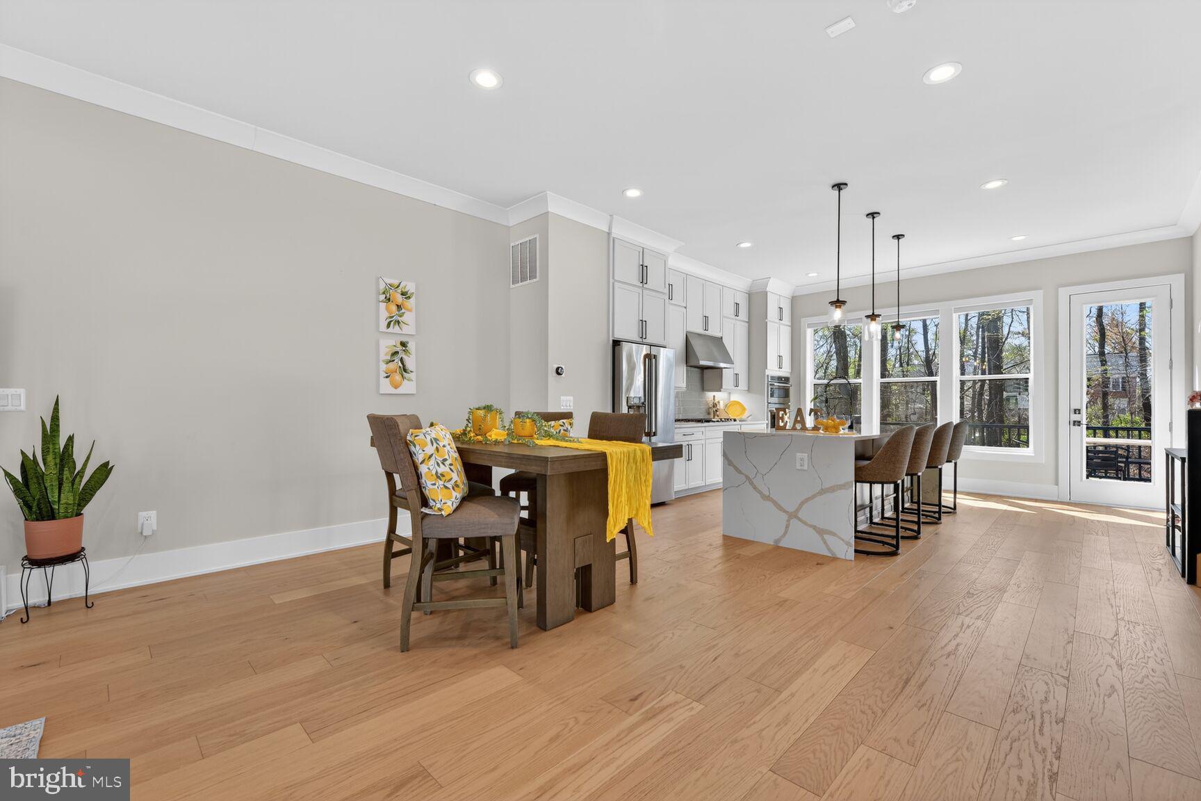 14665 Battery Ridge Lane Centreville, VA 20120 - Photo 18 of 66 a view of a dining room with furniture and wooden floor