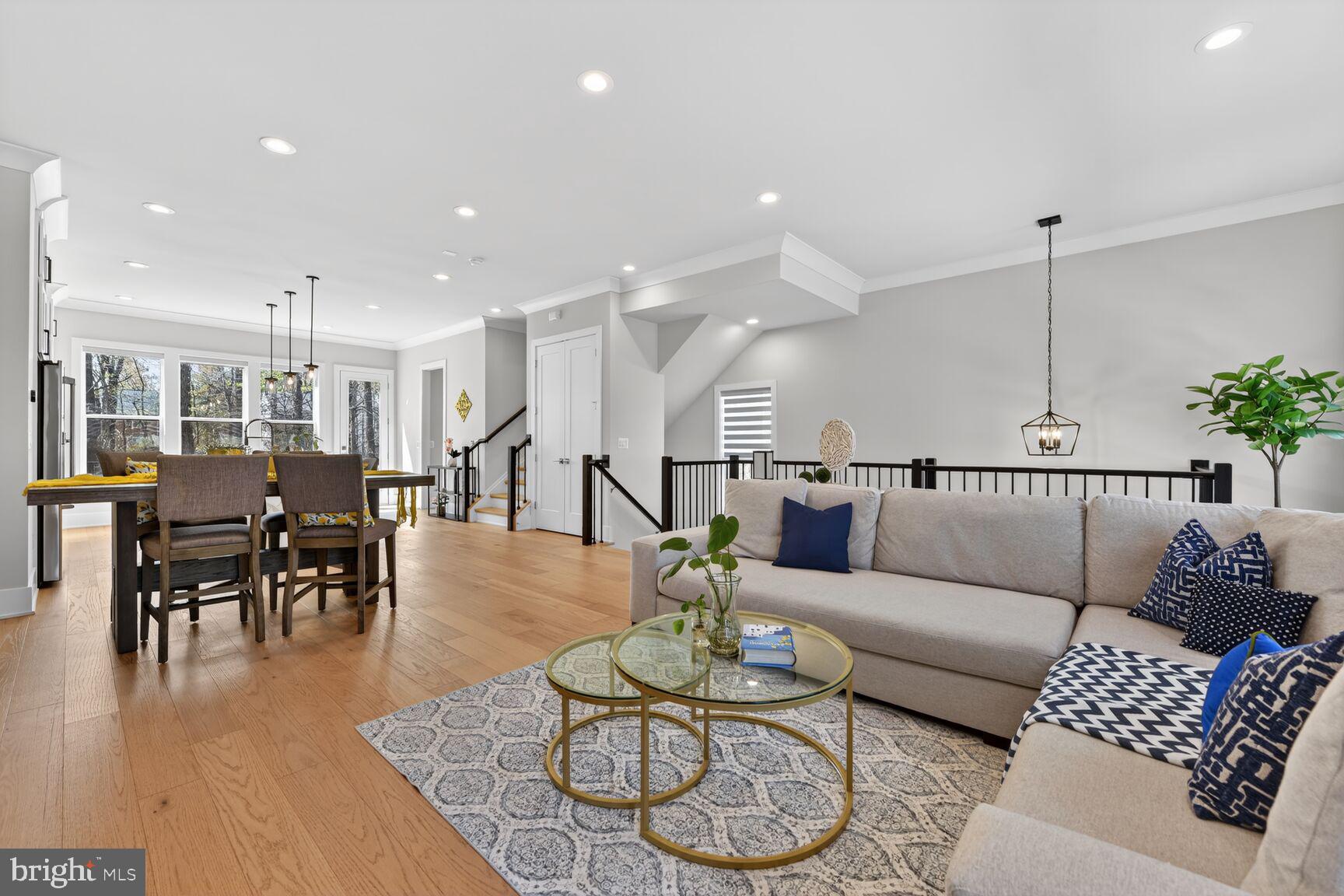 14665 Battery Ridge Lane Centreville, VA 20120 - Photo 21 of 66 a living room with furniture kitchen view and a wooden floor