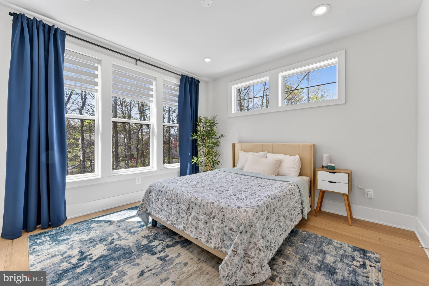 14665 Battery Ridge Lane Centreville, VA 20120 - Photo 28 of 66 a bedroom with a large bed and a window