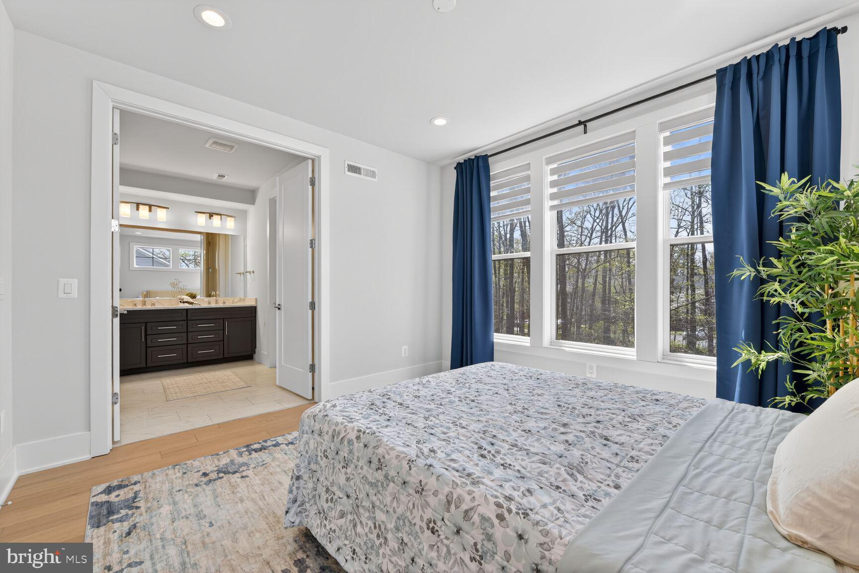 14665 Battery Ridge Lane Centreville, VA 20120 - Photo 29 of 66 a bedroom with a bed and a large window