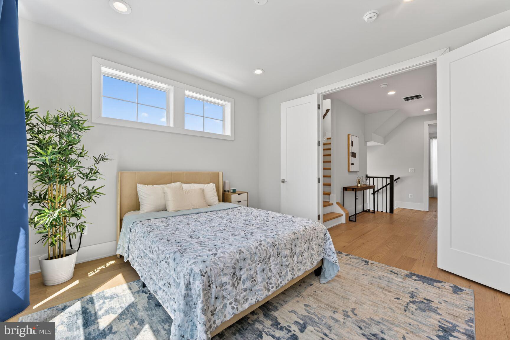 14665 Battery Ridge Lane Centreville, VA 20120 - Photo 30 of 66 a bedroom with a bed and a table