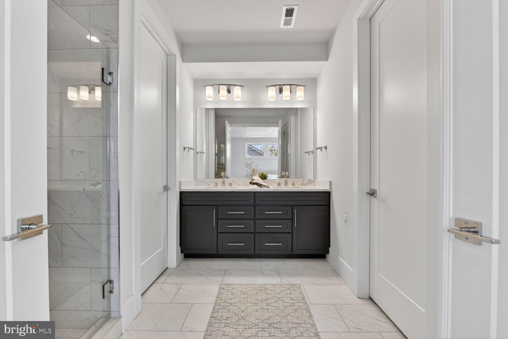 14665 Battery Ridge Lane Centreville, VA 20120 - Photo 31 of 66 a bathroom with a sink vanity and mirror