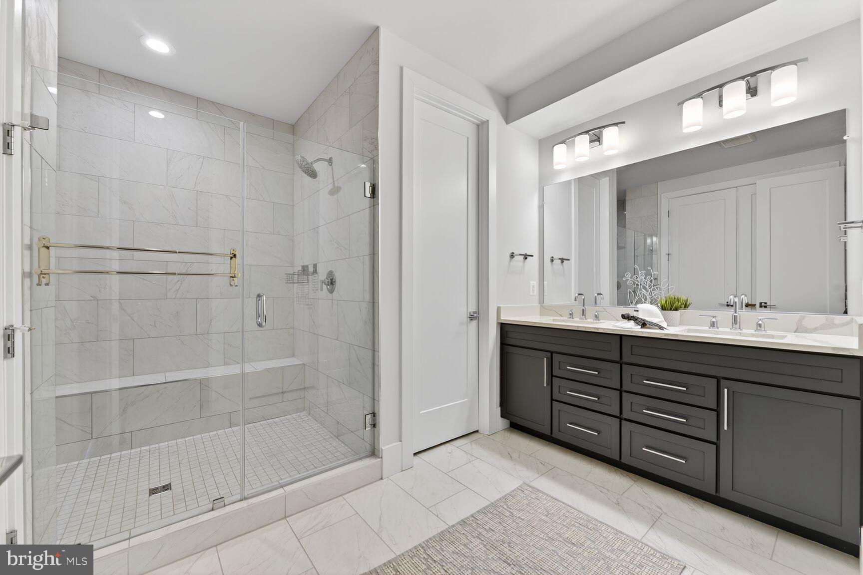 14665 Battery Ridge Lane Centreville, VA 20120 - Photo 32 of 66 a bathroom with double vanity and a shower