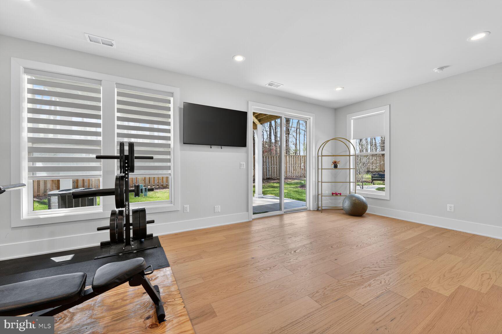 14665 Battery Ridge Lane Centreville, VA 20120 - Photo 47 of 66 a view of a livingroom with furniture and a flat screen tv