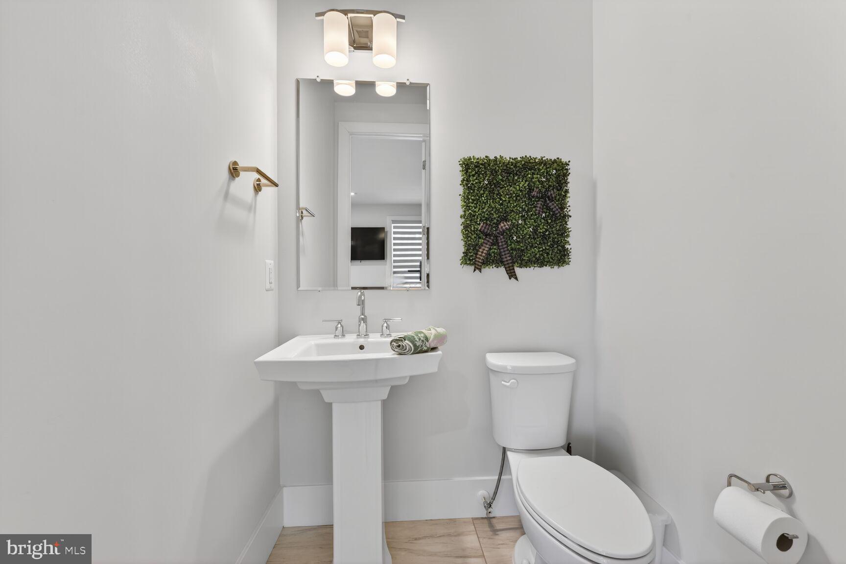 14665 Battery Ridge Lane Centreville, VA 20120 - Photo 49 of 66 a bathroom with a toilet sink and mirror