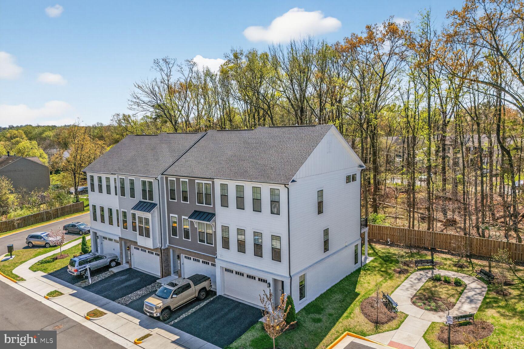 14665 Battery Ridge Lane Centreville, VA 20120 - Photo 8 of 66 a view of a white building among the yard and swimming pool