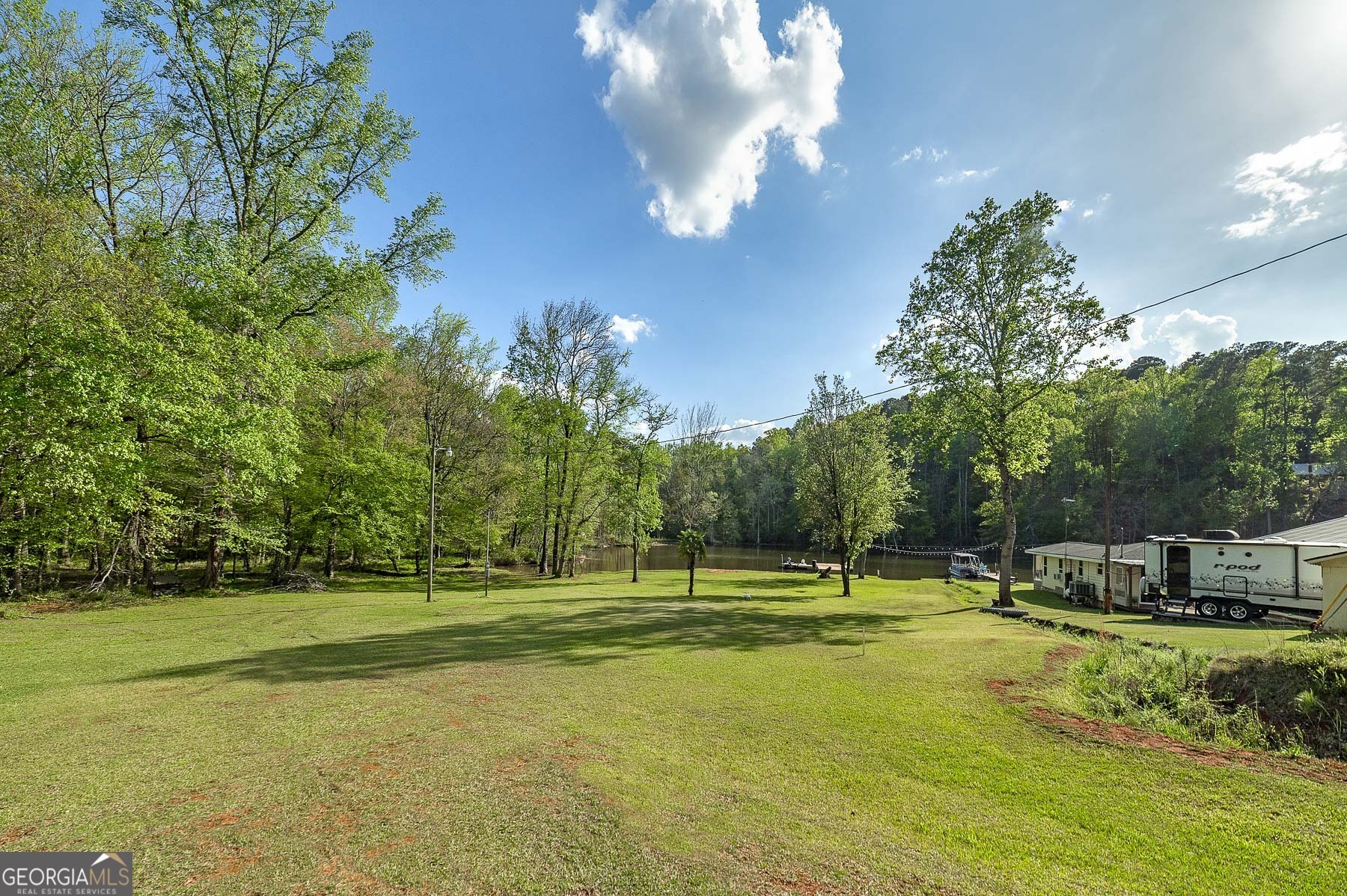167 Edison Lane Monticello, GA 31064 - Photo 14 of 21 a view of a big yard with a fountain