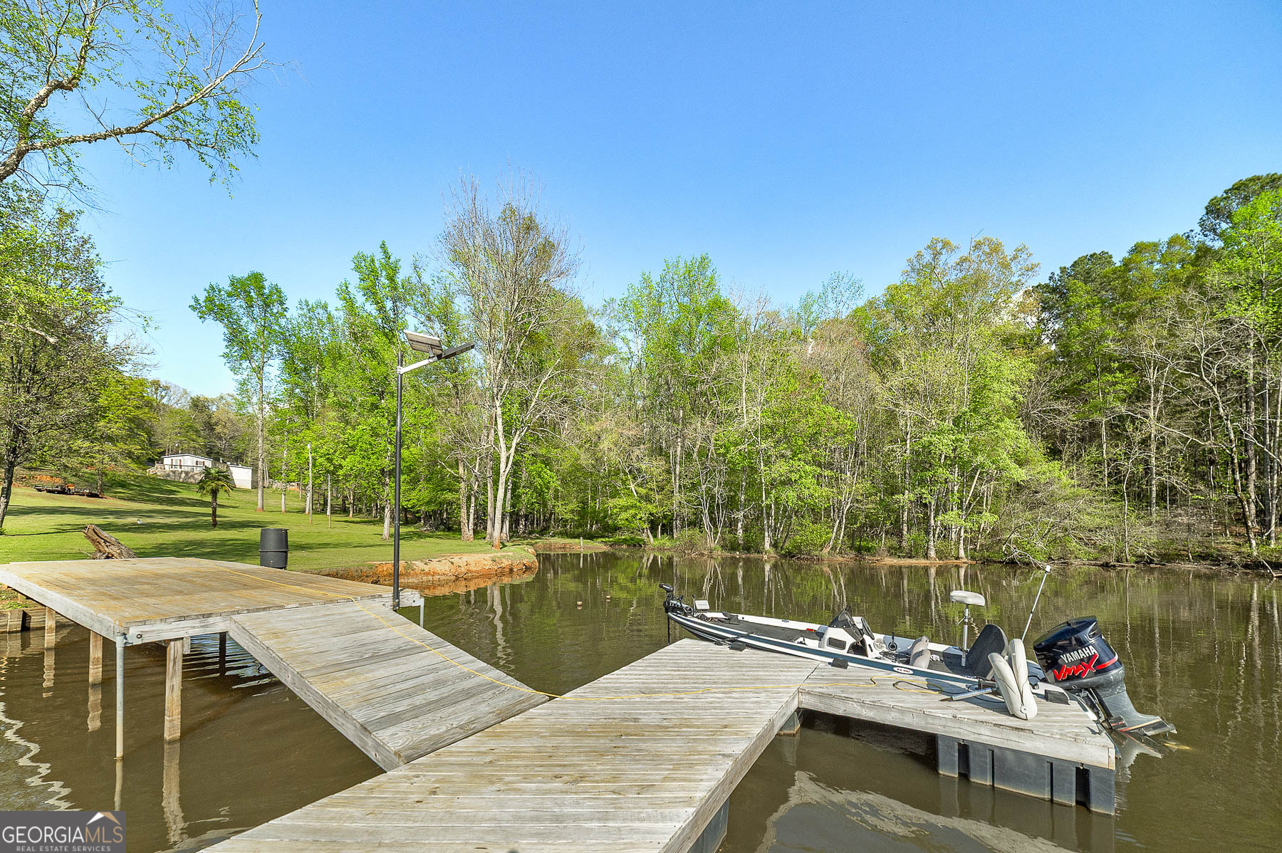 167 Edison Lane Monticello, GA 31064 - Photo 19 of 21 a view of a patio with furniture and a backyard