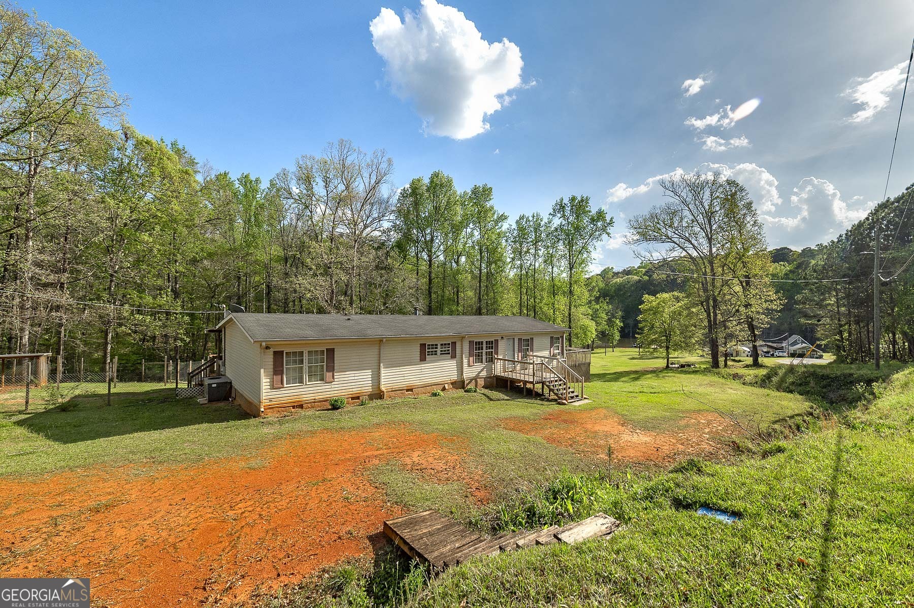 167 Edison Lane Monticello, GA 31064 - Photo 2 of 21 a view of a house with swimming pool and sitting area