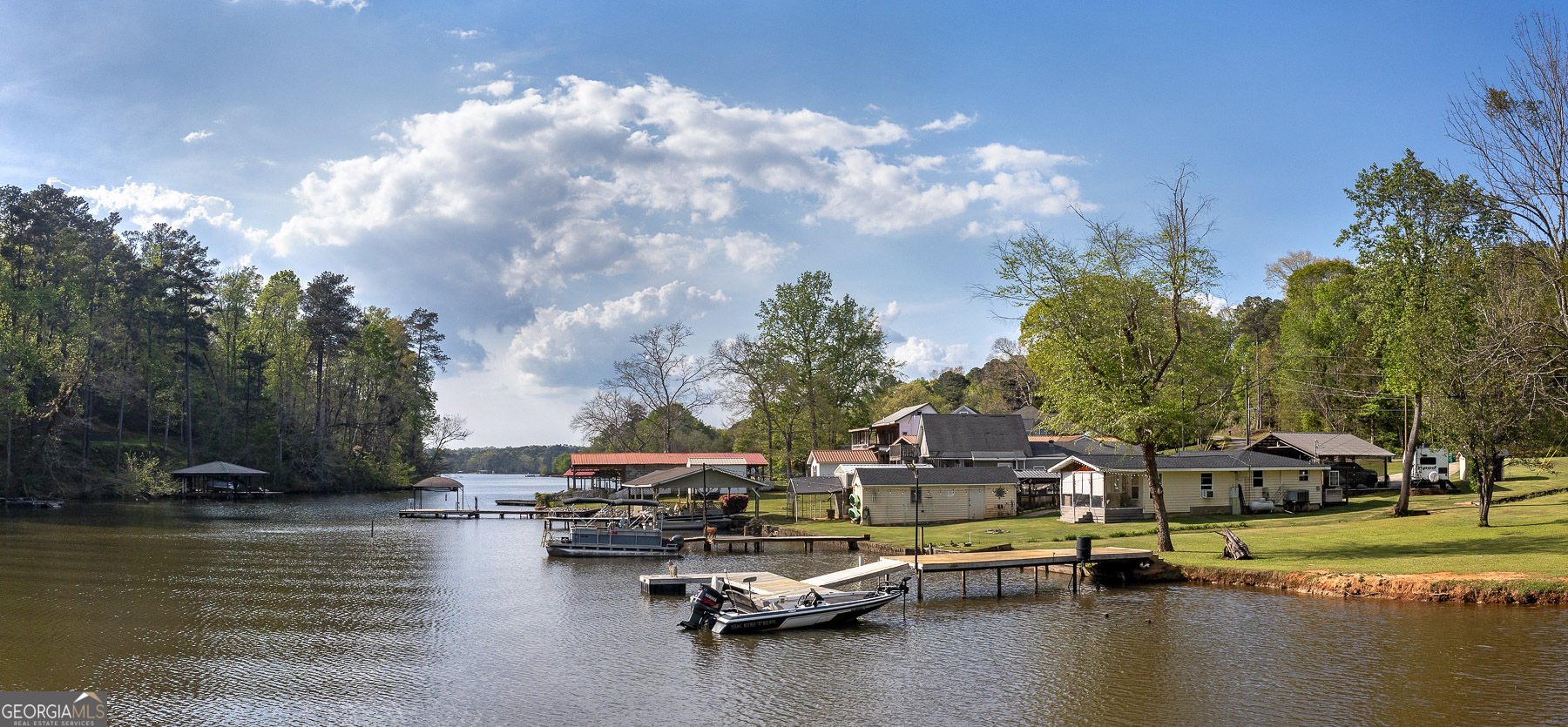 167 Edison Lane Monticello, GA 31064 - Photo 8 of 21 a swimming pool with outdoor seating and yard