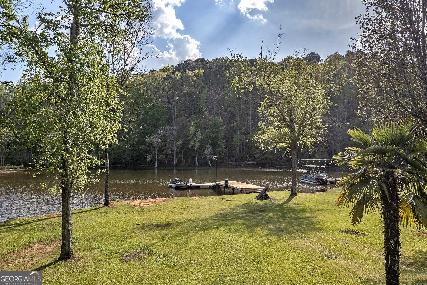 167 Edison Lane Monticello, GA 31064 - Photo 9 of 21 a view of a swimming pool with an outdoor space and seating area