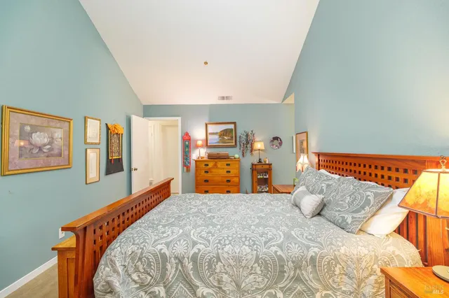 a bed room with a bed and dresser