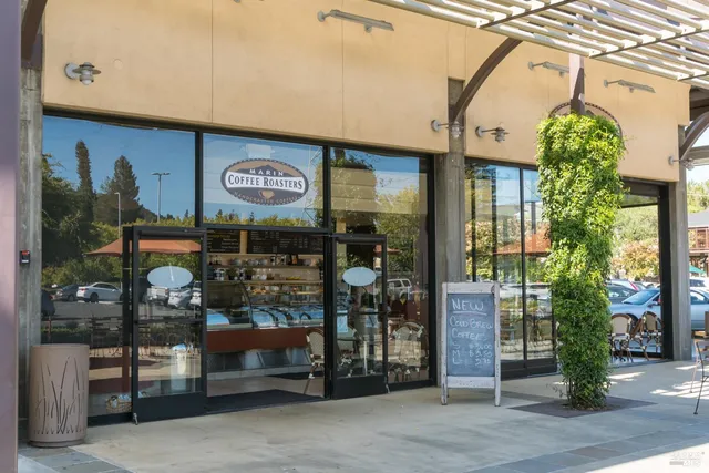 a view of a street with sitting area