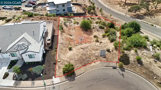 a view of water fountain in front of house