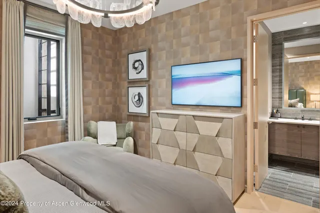 a bathroom with a sink a vanity and a shower