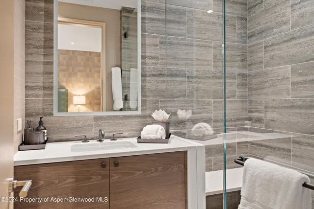 a bathroom with a tub and a shower