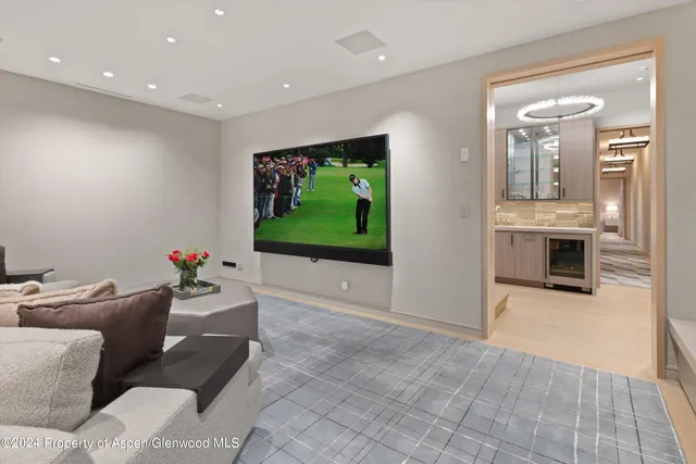 a spacious bathroom with a double vanity sink a mirror and a bathtub