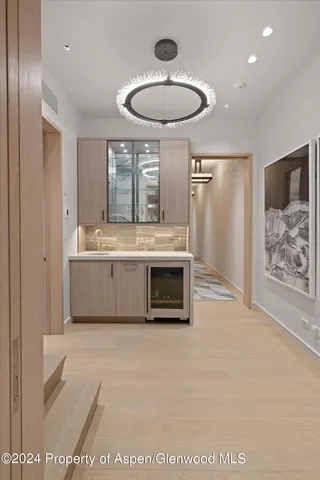 a roof deck with couches and wooden floor