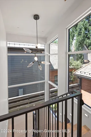 a bathroom with a sink toilet and mirror