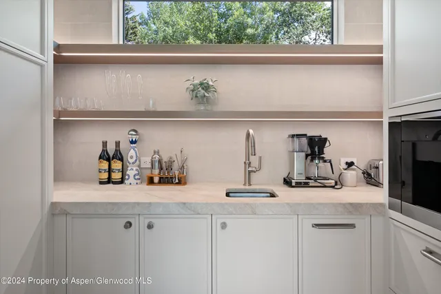 a kitchen with a sink and cabinets