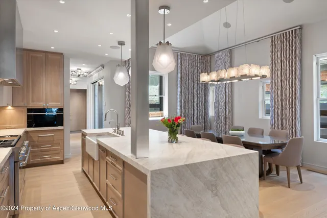 a kitchen with counter top space appliances and cabinets